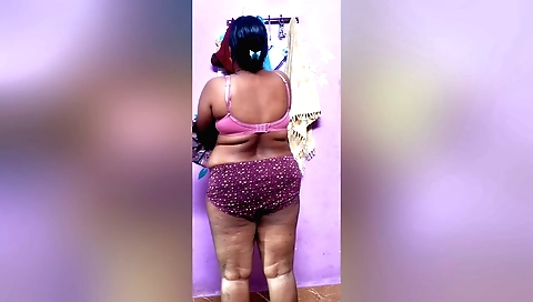 Hot brunette in pink dress is doing her solo video