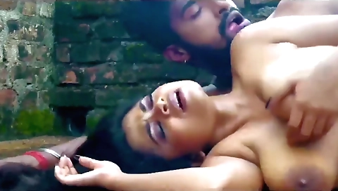 Busty girl gets on the beach and gets her ass slapped by a guy