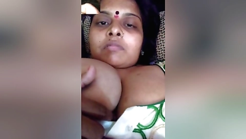 Busty indian milf is showing off herself on web cam video