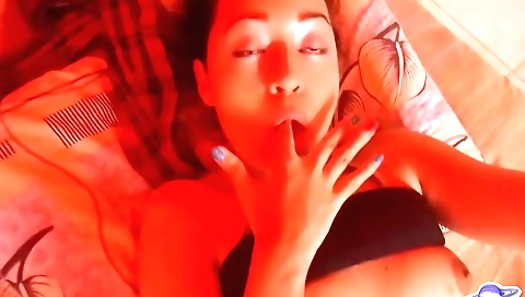 Cute brunette is having fun with herself in a solo video
