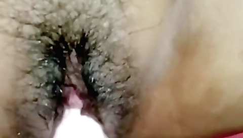 Indian girl plays with a big vibrator in the bedroom