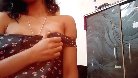 Asian girl in a black dress with her wet pussy exposing