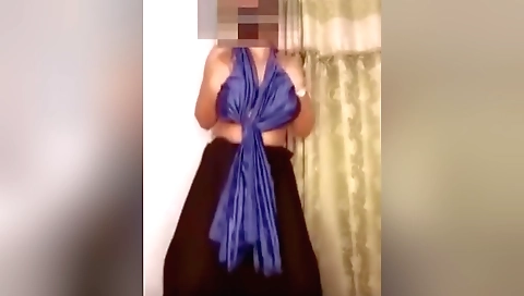 Busty brunette chick dances in a sexy pose in a hot dance