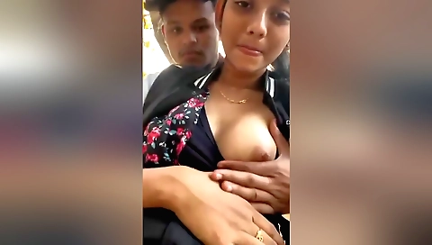Indian girl riding a motorcycle outdoors in the park