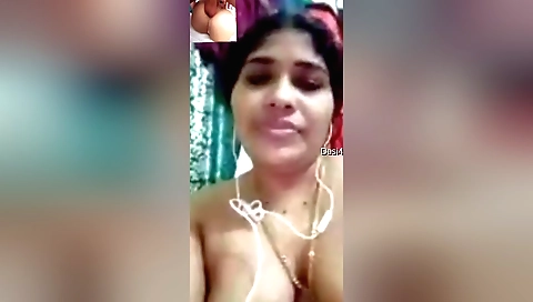 Bhabhi in long dress shows her big boobies to a webcam