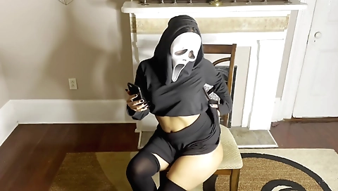 Busty brunette with a ghost face and a tattooed pussy in amateur