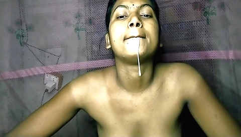 Indian beauty giving a facial and a handjob in the bedroom