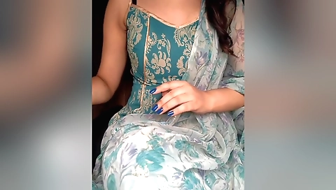 Amateur brunette beauty is applying some nail polish