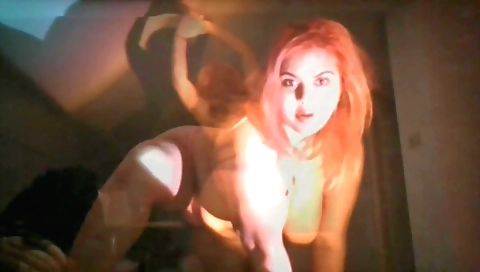 Red head with a beautiful body enjoys solo dancing