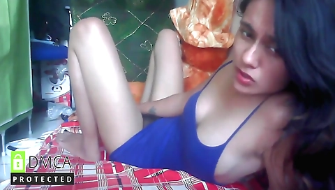 Sexy teen with a sexy face plays with toy in front of a web cam