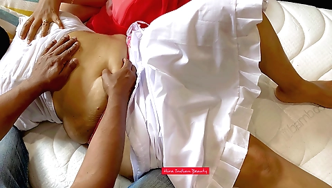Indian massage girl gives a massage to her stepson