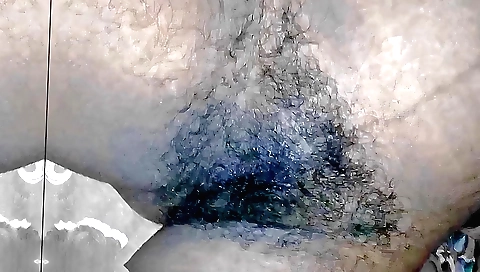 Amateur solo fetish video showing a girl's hairy pussy