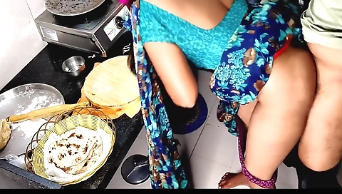 Indian amateur aunt working in kitchen in the bedroom