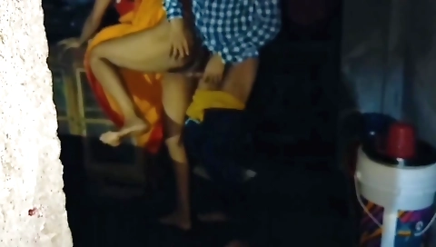 Indian housewife in red dress performing in the village